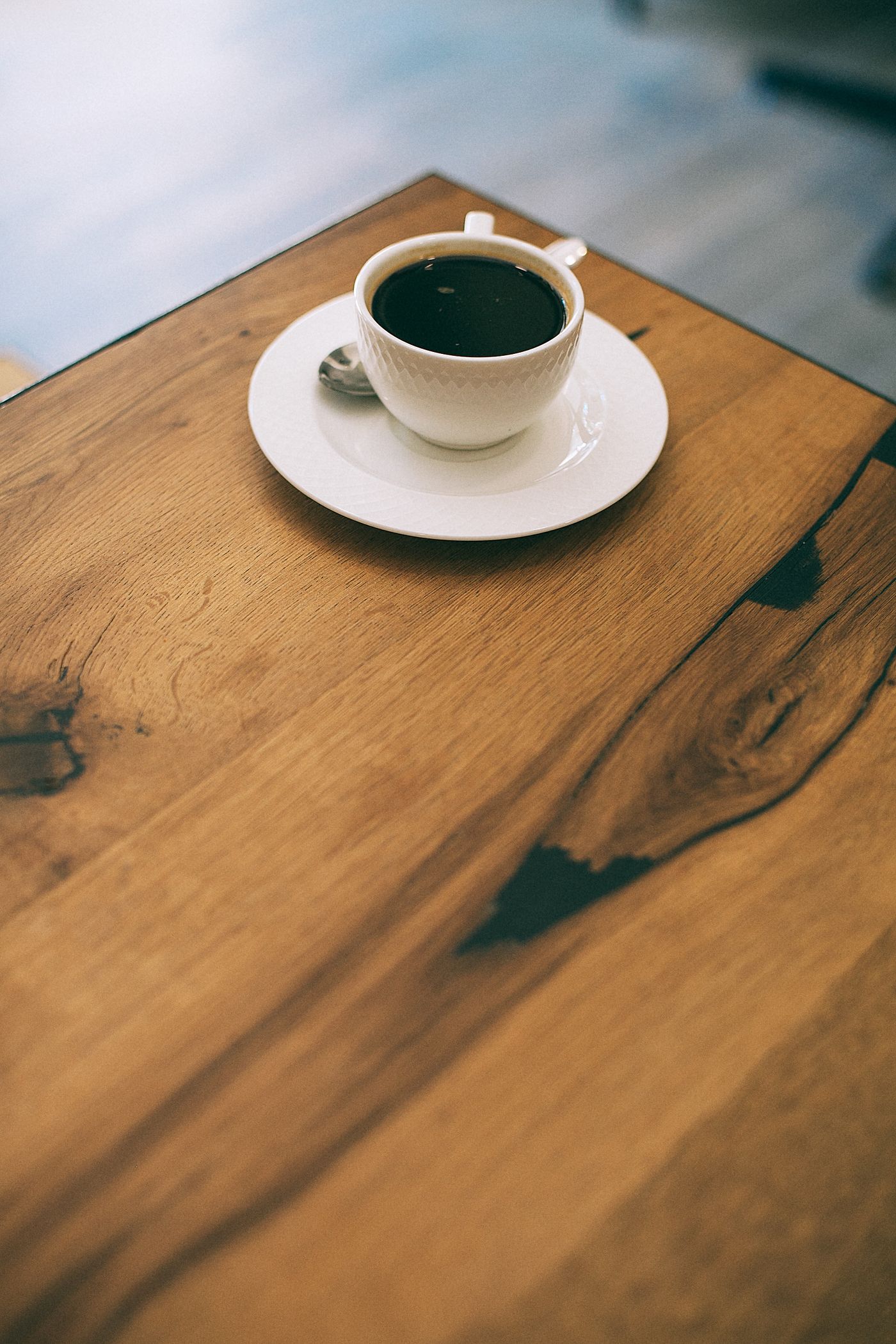Coffee on a wooden table as a composition reference